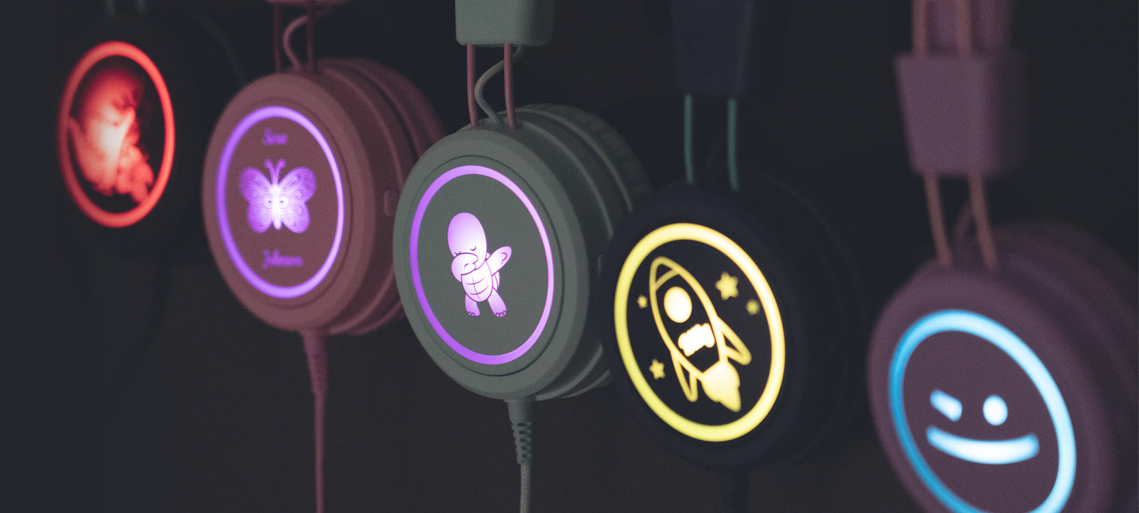 Children wearing KidJamz headphones designed with custom graphics