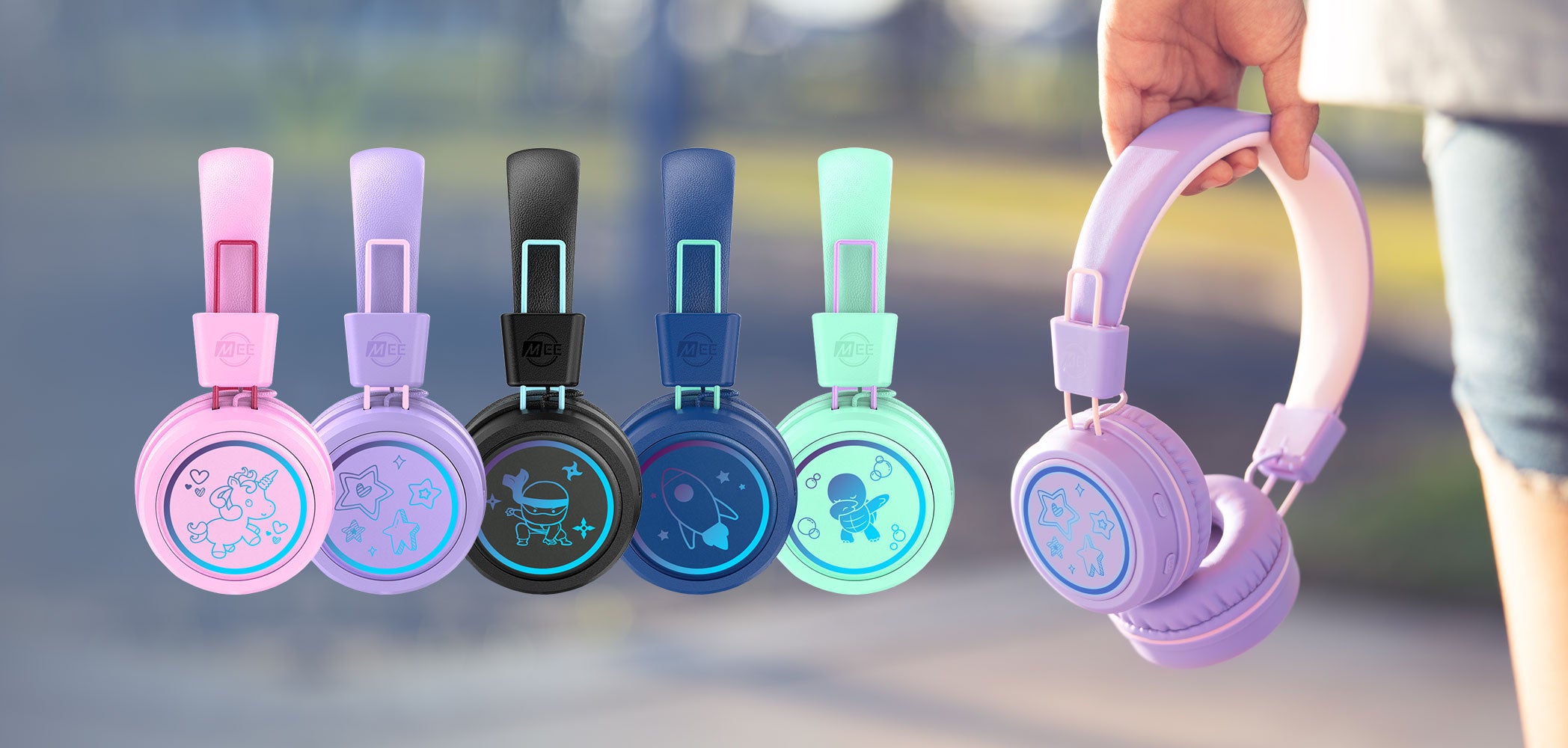 Child wearing KidJamz volume limiting Bluetooth headphones with LED lights